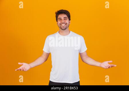 handsome man pointing to the side with space for text Stock Photo