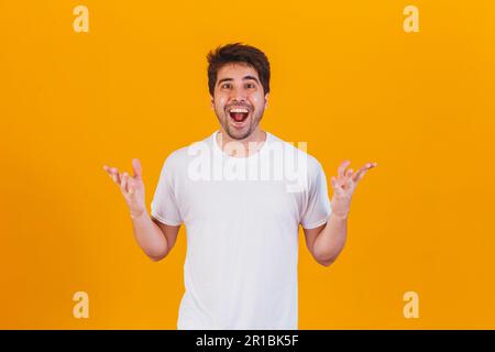 handsome man pointing to the side with space for text Stock Photo
