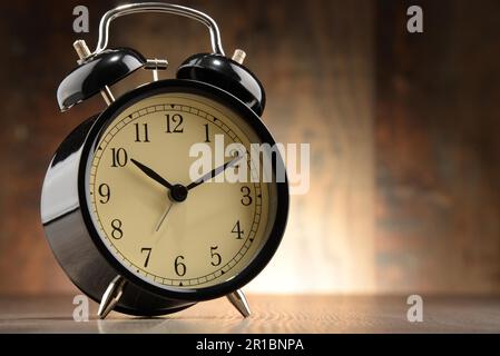 Composition with old black alarm clock Stock Photo