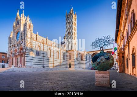 Siena, Italy. Beautiful view of facade and campanile of Duomo di Siena, morning sunrise, scenic Tuscany. Stock Photo