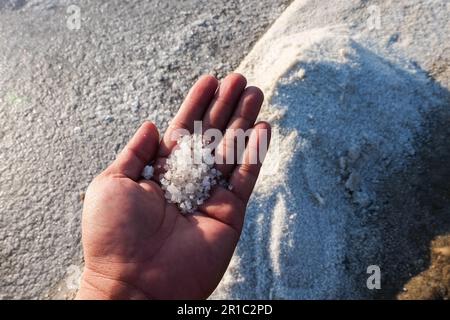 The process of crystallization of sea water into salt in the traditional way in Indonesia. Stock Photo