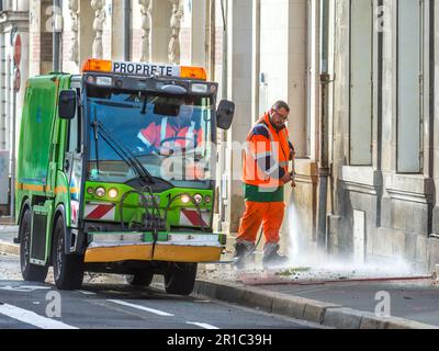 Council workers cleaning pavement with water jet, Tours, Indre-et-Loire (37), France. Stock Photo