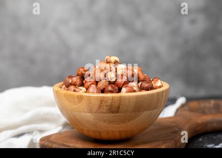 Hazelnut. Peeled hazelnuts in wooden bowl. Superfood. Vegetarian food concept. Healthy snacks Stock Photo