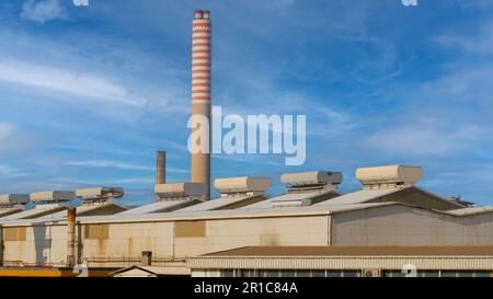 chimney in reinforced concrete of the Portovesme industries in southern Sardinia Stock Photo