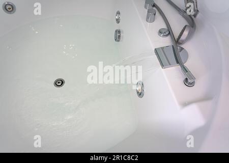 Round jacuzzi inside a room to enjoy and relax in the water. Stock Photo