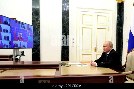 Moscow, Russia. 12th May, 2023. Russian President Vladimir Putin hosts a remote video conference with the permanent members of the Security Council from the Kremlin, May 12, 2023 in Moscow, Russia. The meeting coincided with reports of Russian forces being pushed back from positions in Bakhmut. Credit: Mikhail Klimentyev/Kremlin Pool/Alamy Live News Stock Photo