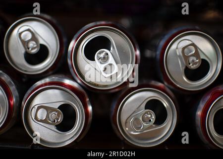Closeup, Stainless steel beer cans Were opened and then stacked horizontally. Blurred Background. Stock Photo