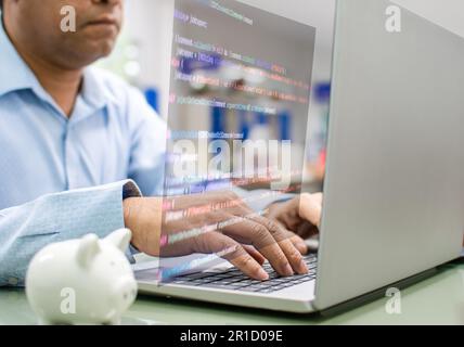 Programmers write coding apps for use with business services on the Internet. Programmers sit and write programs with their laptop computers. Develope Stock Photo