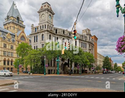 Gridley Building, originally Onondaga County Savings Bank Building, is a grey stone landmark with clock tower facing Clinton Square. Stock Photo