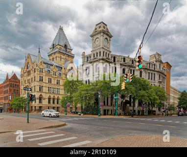 Gridley Building, originally Onondaga County Savings Bank Building, is a grey stone landmark with clock tower facing Clinton Square. Stock Photo