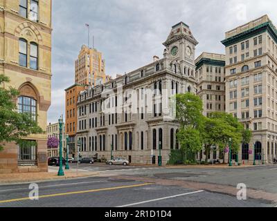 Gridley Building, originally Onondaga County Savings Bank Building, is a grey stone landmark with clock tower facing Clinton Square. Stock Photo