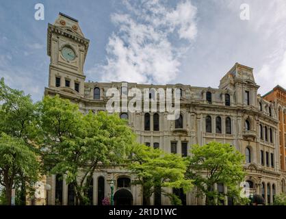 Gridley Building, originally Onondaga County Savings Bank Building, is a grey stone landmark with clock tower facing Clinton Square. Stock Photo