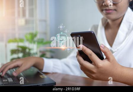 Business woman are working and bringing AI to help them work on computers. Chat bot. Chat with AI Stock Photo