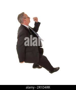 Senior businessman with a rather interesting expression and in a hurry Stock Photo
