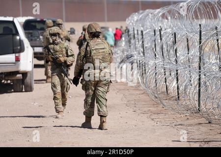 El Paso, United States. 11th May, 2023. Texas Army National Guard soldiers with the governors self-styled Texas Tactical Border Force, guard the border with Mexico as part of Operation Lone Star Task Force West, May 11, 2023 near El Paso, Texas. The fear over a migrant surge after Title 42 expired failed to materialize with fewer migrants risking the tougher penalties under the new Title 8 rules. Credit: Mark Otte/Texas National Guard/Alamy Live News Stock Photo