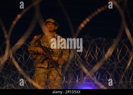 El Paso, United States. 11th May, 2023. Texas Army National Guard soldiers with the governors self-styled Texas Tactical Border Force, on overnight security detail during Operation Lone Star Task Force West, May 11, 2023 near El Paso, Texas. The fear over a migrant surge after Title 42 expired failed to materialize with fewer migrants risking the tougher penalties under the new Title 8 rules. Credit: Mark Otte/Texas National Guard/Alamy Live News Stock Photo