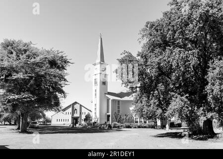 Keimoes, South Africa - Feb 28 2023: The Dutch Reformed Church and Hall in Neilersdrift, near Keimoes in the Northern Cape Province. Monochrome Stock Photo