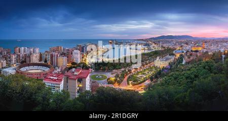 Panoramic aerial view with Plaza de Toros, Port of Malaga, City Hall and Cathedral at sunset - Malaga, Andalusia, Spain Stock Photo