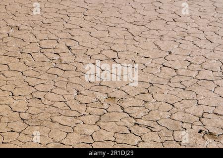 Drought, ground cracks, no hot water. Dry land in the dry season.  Lack of humidity effect from global cracked soil in summer. Stock Photo