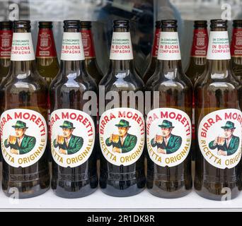 A display of bottles of Birra Moretti, a popular Italian beer.  The brand was founded in 1859 by Luigi Moretti.  It was sold in 1989 to a brewers cons Stock Photo