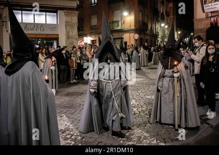 Members of the Penitential Brotherhood of the Sacred Passion of Christ outside Iglesia Vera Cruz during Semana Santa in Valladolid, Spain Stock Photo