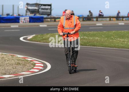 Antrim, Northern Ireland, UK. 13th May 2023: fonaCAB Nicholl OilsNorth West 200, Portrush, Antrim, Northern Ireland: North West 200 Race Day 2023: Marshalls employ electronic scooter devices to get around the NW200 course Credit: Action Plus Sports Images/Alamy Live News Stock Photo