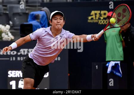 Rome, Italy. 13th May, 2023. Yoshihito Nishioka of Japan returns to Lorenzo Sonego of Italy during their match at the Internazionali BNL d'Italia tennis tournament at Foro Italico in Rome, Italy on May 13th, 2023. Credit: Insidefoto di andrea staccioli/Alamy Live News Stock Photo