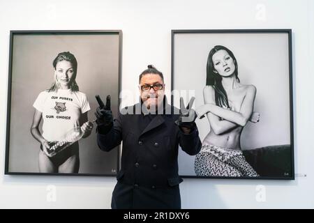 London UK. 13 May 2023. Michel Haddi (pictured)  stands with portraits of Cameron Diaz, Vogue Hommes Magazine Venice Beach, California1993, Kate Moss for British GQ, New York1991 Courtesy of 29 ARTS IN PROGRESS gallery. The eight edition of Photo London at Somerset House London showcasing 126 leading international galleries and publishers who  show and sell work by photographers with  curated exhibitions and talks. Credit: amer ghazzal/Alamy Live News Stock Photo