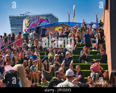 Colourful Eurovision crowds at Liverpool on Saturday 13th May, the day of the Eurovision Final. Taken on a sunny day at the pier Head and Albert Dock Stock Photo