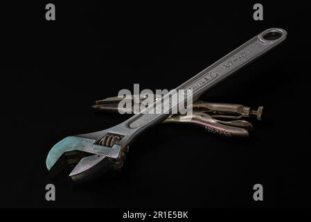 Adjustable mechanical wrench and original Vise-Grip crimping pliers. Tools for repairing and connecting mechanical components, used by mechanics. Stock Photo
