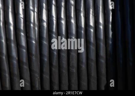 cable is wound on a wooden reel as a background Stock Photo