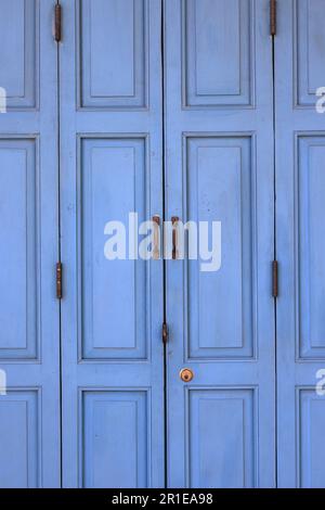 traditional old Blue Painted Wooden Folding door. Stock Photo