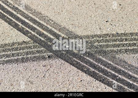 Close-up of several tire skid marks on asphalt Stock Photo