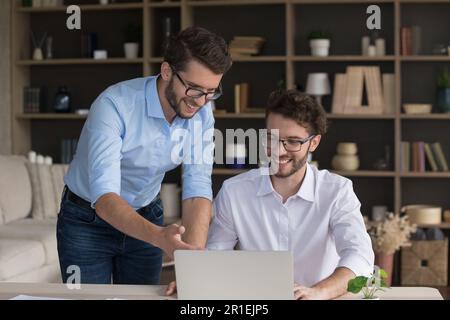 Happy family startup business colleague men working on successful project Stock Photo