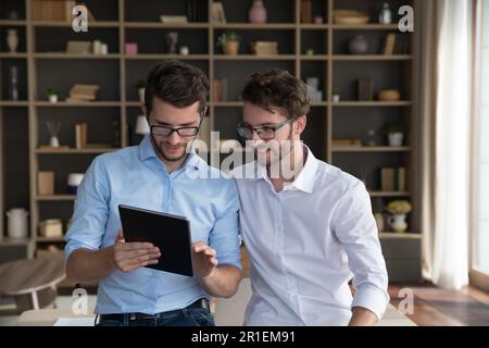 Positive successful family business startup owners talking Stock Photo