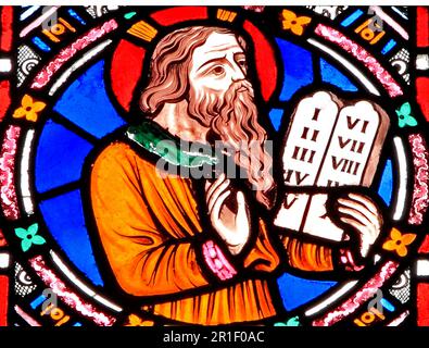 Moses, holding tablet of Ten Commandments, stained glass, by Frederick Preedy, Snettisham, Norfolk, England Stock Photo