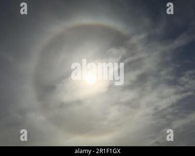 Sun with circular rainbow sun halo occurring due to ice crystals in ...