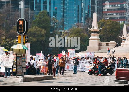 Protestors gather at the Angel of Independence statue on Paseo de la Reforma in Mexico City, Mexico Stock Photo