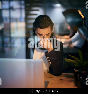 Stress, headache and burnout with a woman programmer working on a laptop in her office for design. Tired, 404 and deadline with a female employee Stock Photo