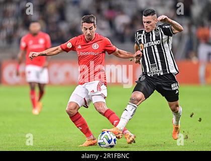 Belo Horizonte, Brazil. 13th May, 2023. Mineirao Stadium Cristian Pavon of Atletico Mineiro competes against Carlos de Pena of Internacional, during the match between Atletico Mineiro and Internacional, for the 6th round of the Brazilian Championship, at Estadio do Mineirao, this Saturday, 13. 30761 (Gledston Tavares/SPP) Credit: SPP Sport Press Photo. /Alamy Live News Stock Photo