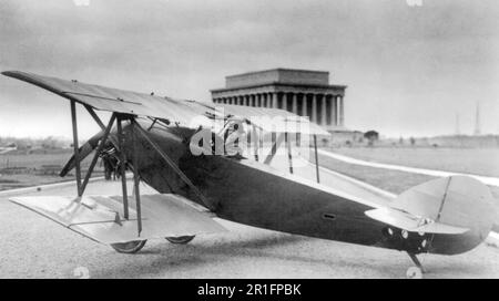Archival Photo: Lawrence Sperry, head-and-shoulders portrait, facing left, seated in cockpit of Sperry airplane; Lincoln Memorial in background, Washington, D.C. ca. 1922 Stock Photo