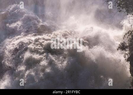Detail of the roaring waters thundering down victoria falls, in Zimbabwe. Stock Photo