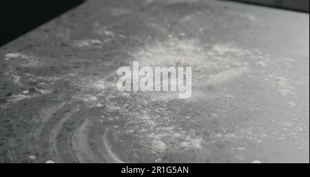 sprinkles flour on countertop surface, wide photo Stock Photo