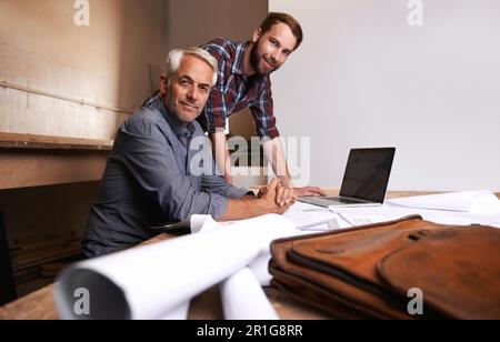 Architects, teamwork and portrait of men in workshop with blueprint for building construction. Senior engineer, father and son working on design Stock Photo