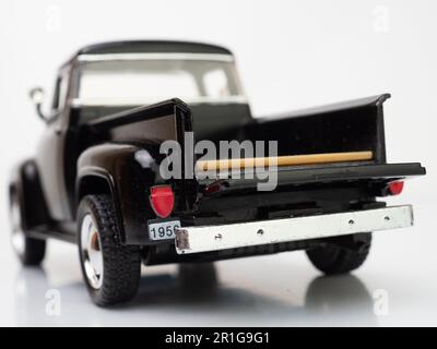 Back view of a black truck miniature toys with open tailgate door Stock Photo