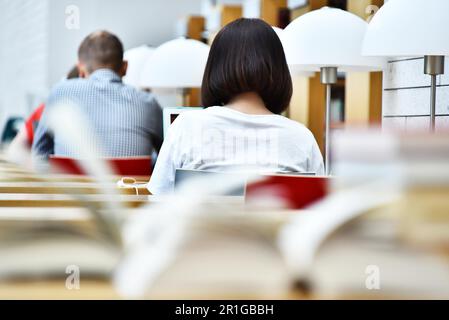 Students reading in a public library Stock Photo