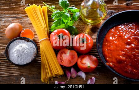 Composition with dried spaghetti, and pasta ingredients Stock Photo