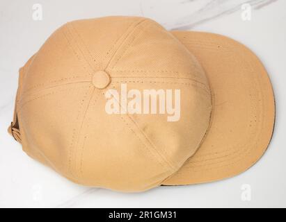 Top view of a brown baseball hat on a white background Stock Photo