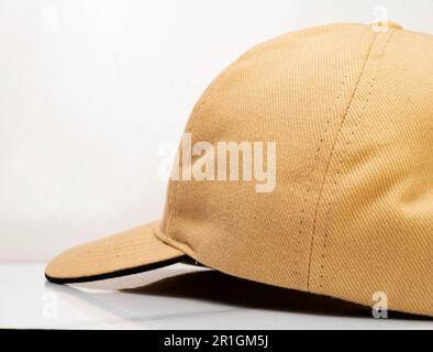 Side view of a brown baseball hat on a white background Stock Photo
