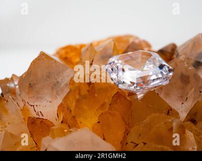 Sparkling asscher cut diamond with rough stone background Stock Photo
